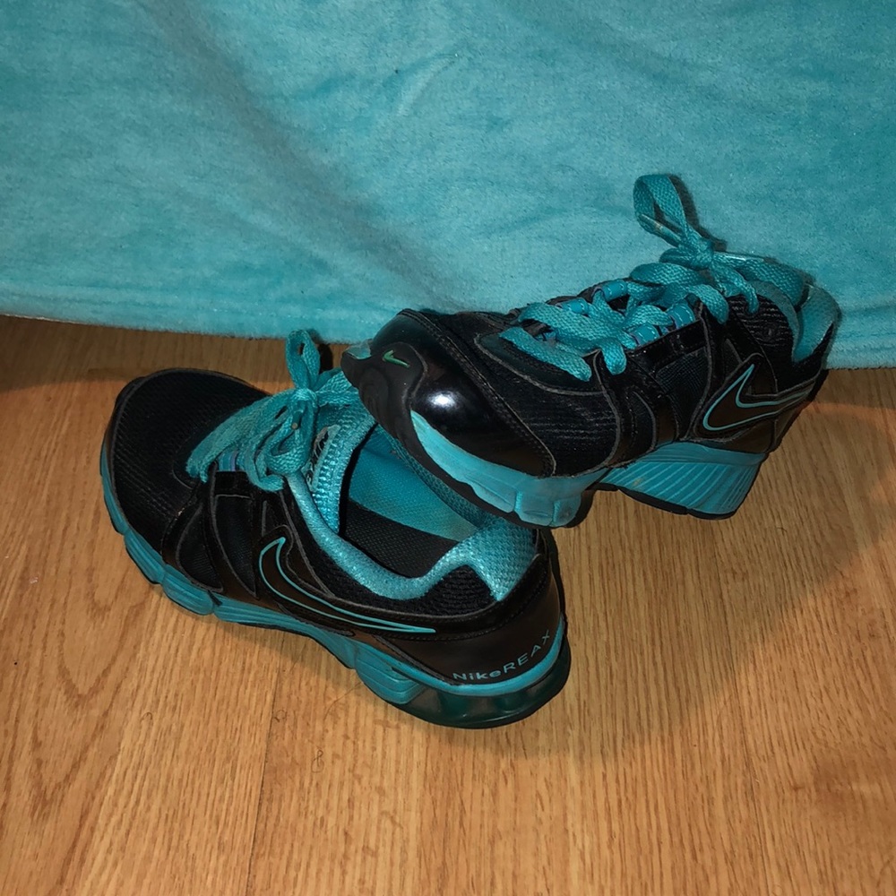 Black & blue nike Reax.